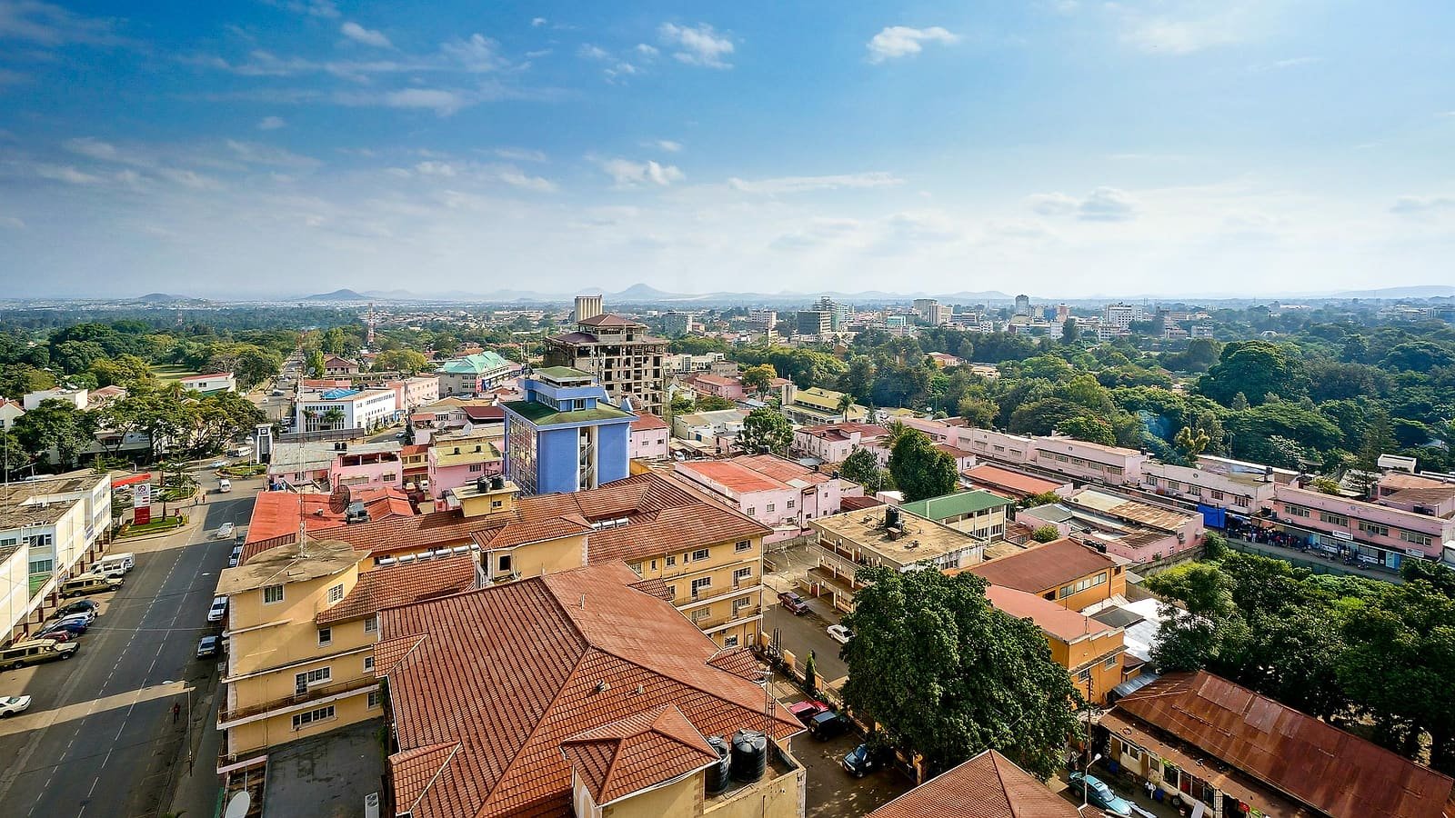 Arusha from above, its rooftops running out to the hills