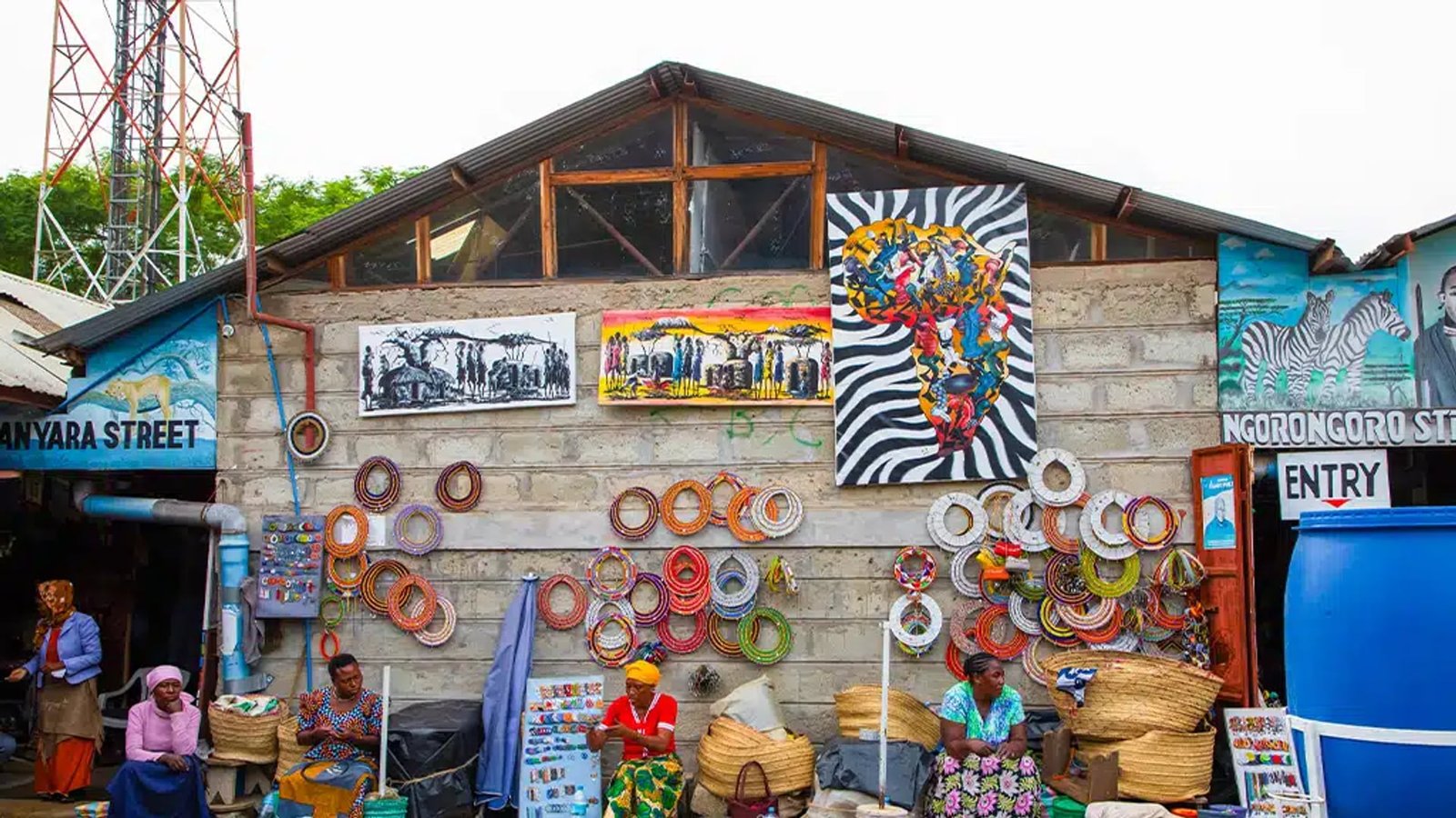Basket and beadwork stalls at a roadside Arusha craft market