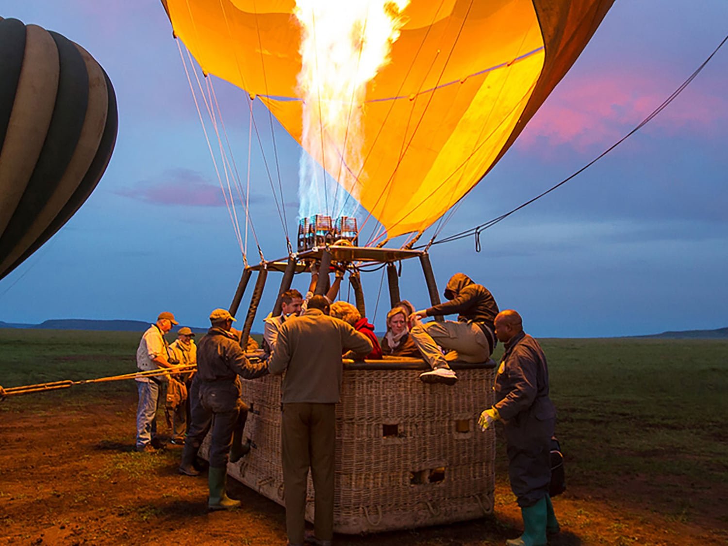 The burner firing as the balloon is inflated at the launch site before dawn