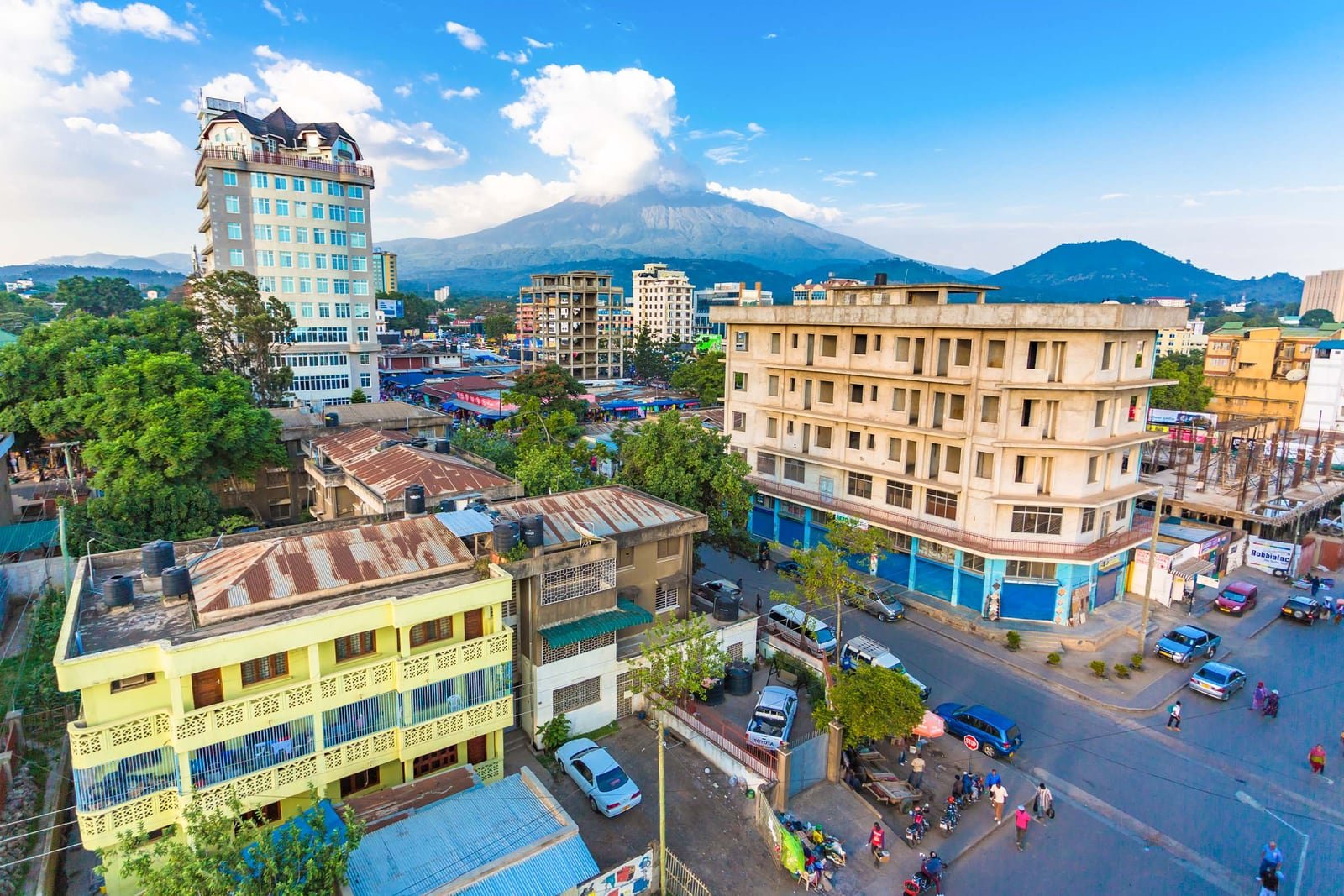 Arusha town spread below Mount Meru, seen from an upper-floor rooftop