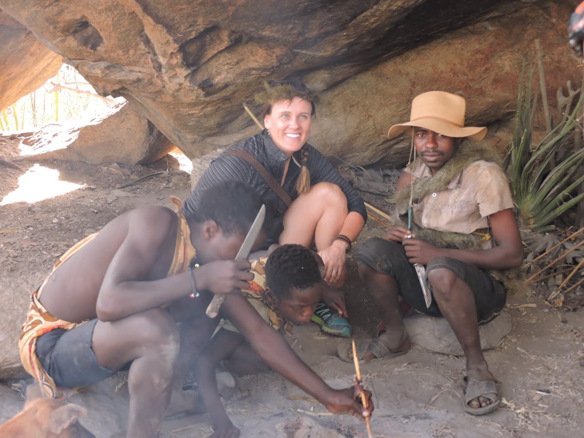 Hadzabe hunters making fire with guests