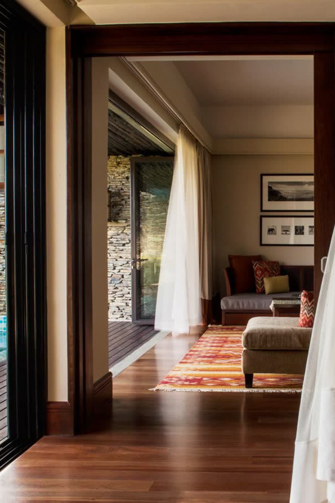 An infinity pool over the waterhole at Four Seasons Lodge, Central Serengeti